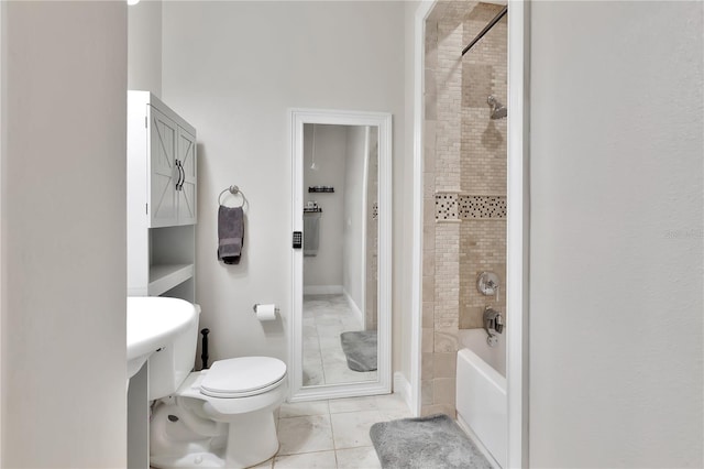 bathroom with toilet and tile patterned flooring