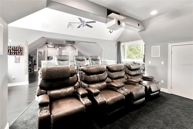 cinema room featuring dark hardwood / wood-style floors, vaulted ceiling, and ceiling fan