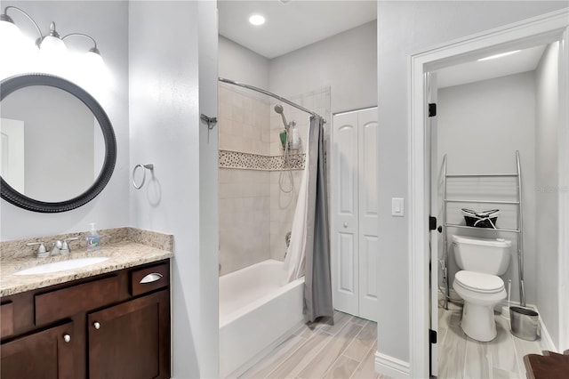 full bathroom featuring shower / tub combo, tile patterned flooring, toilet, and vanity