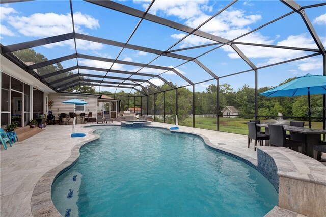 view of pool featuring a patio and a lanai