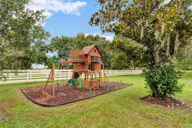 view of jungle gym with a yard