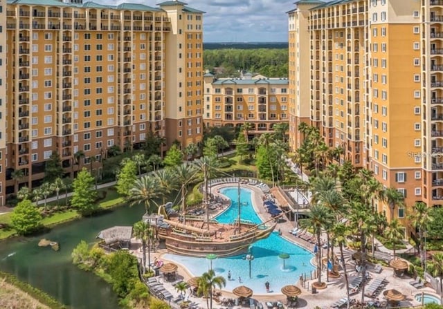 view of pool featuring a water view