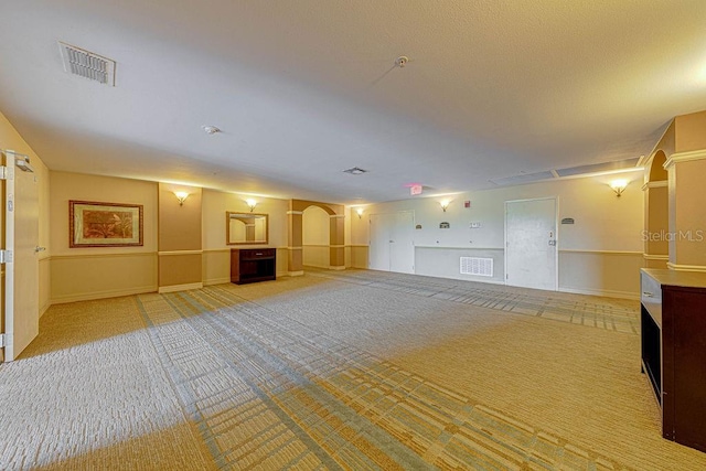 unfurnished room featuring light colored carpet