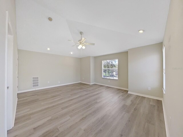 unfurnished room with light wood-type flooring and ceiling fan