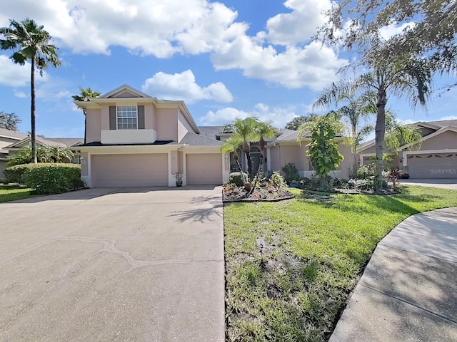 view of front facade with a front lawn and a garage