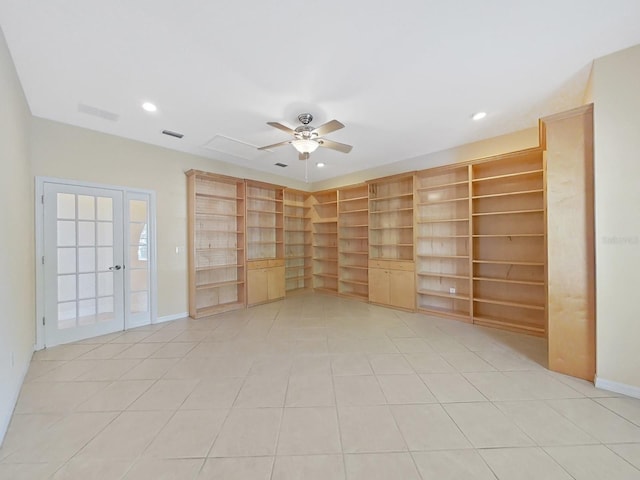 tiled spare room with ceiling fan