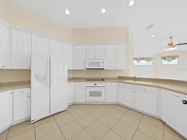 kitchen with white appliances, sink, light tile patterned flooring, white cabinetry, and ceiling fan