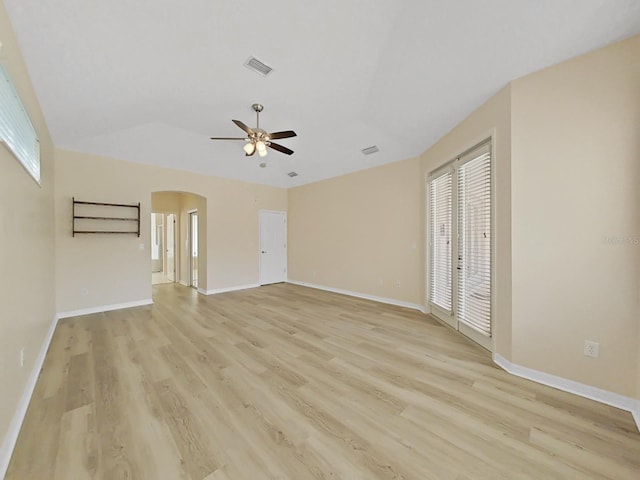 unfurnished living room featuring light wood-type flooring, vaulted ceiling, and ceiling fan