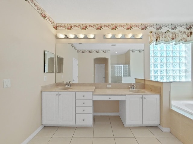 bathroom featuring vanity, shower with separate bathtub, and tile patterned flooring