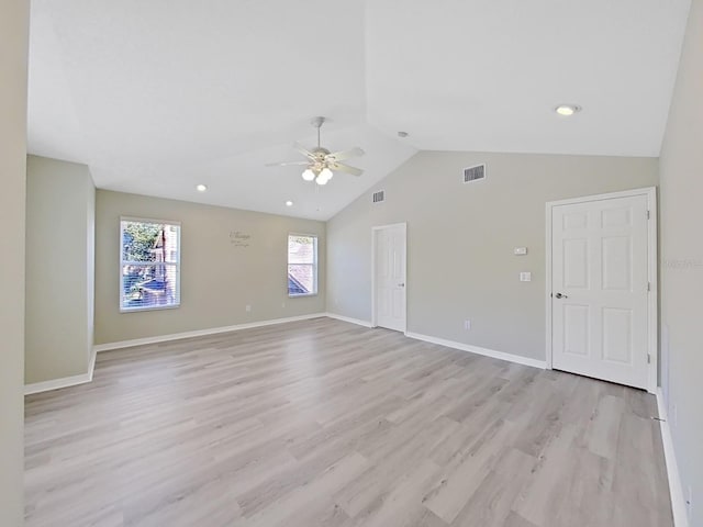 empty room with light wood-type flooring, lofted ceiling, and ceiling fan