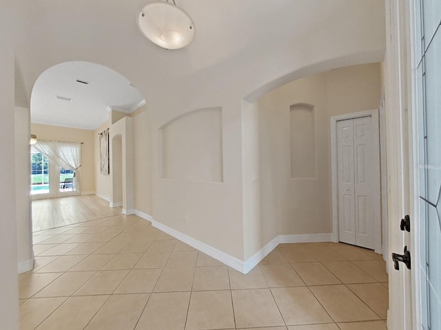 hallway featuring light tile patterned flooring