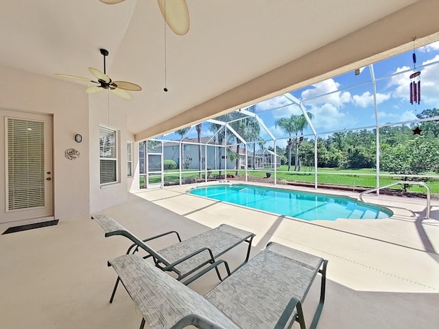 view of pool with a patio, ceiling fan, and a lanai