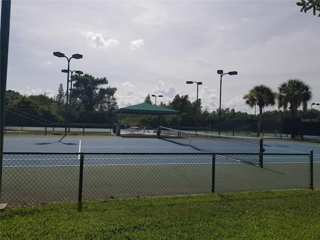 view of tennis court featuring a gazebo