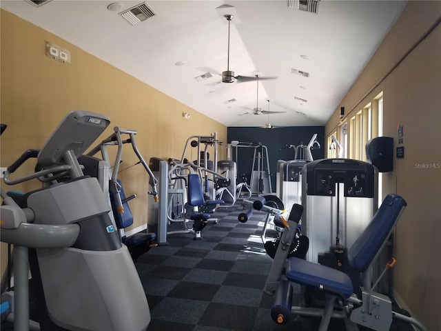 exercise room featuring vaulted ceiling