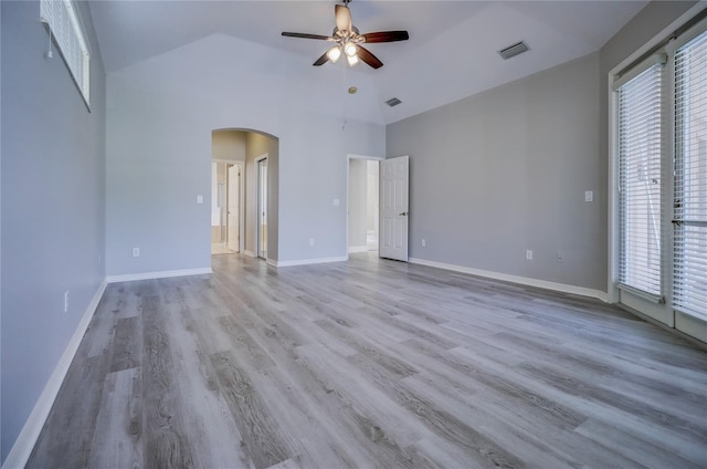 19334 Autumn Woods Ave, Tampa, FL 33647 - empty room with arched walkways, ceiling fan, visible vents, and a wealth of natural light