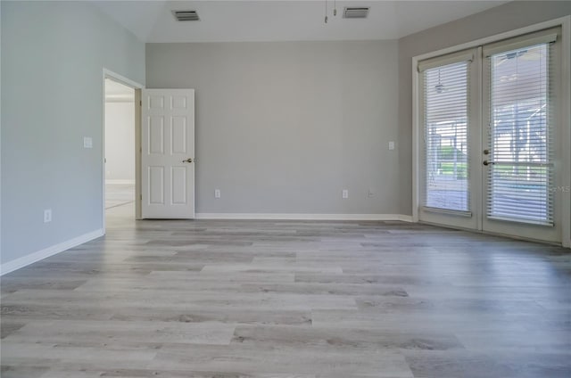 19334 Autumn Woods Ave, Tampa, FL 33647 - unfurnished room featuring visible vents, french doors, and wood finished floors