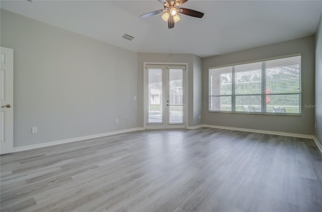 19334 Autumn Woods Ave, Tampa, FL 33647 - empty room featuring a ceiling fan, baseboards, visible vents, and wood finished floors