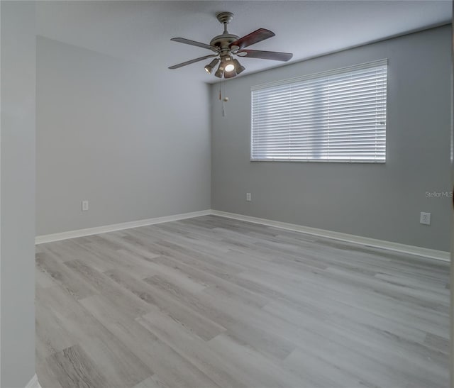 19334 Autumn Woods Ave, Tampa, FL 33647 - unfurnished room featuring baseboards, ceiling fan, and wood finished floors