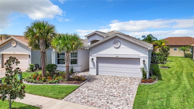 ranch-style home featuring a garage and a front yard