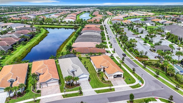 birds eye view of property featuring a water view