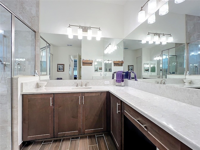 bathroom with vanity and an enclosed shower