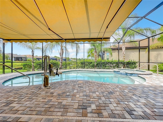 view of pool with an in ground hot tub, a lanai, and a patio area