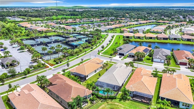 birds eye view of property with a water view