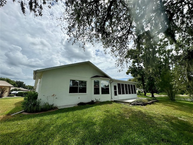 rear view of house with a yard