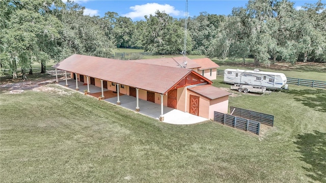 birds eye view of property with a rural view