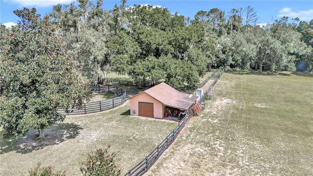 birds eye view of property with a rural view