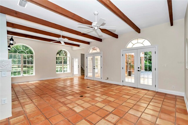 unfurnished living room featuring light tile patterned flooring, a healthy amount of sunlight, french doors, and ceiling fan