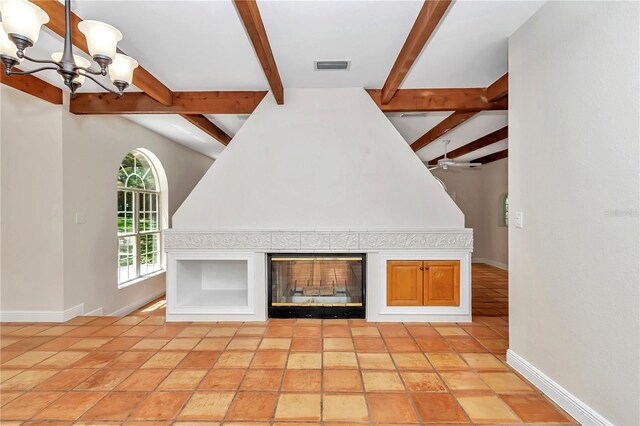 interior space featuring beamed ceiling, ceiling fan with notable chandelier, and light tile patterned floors