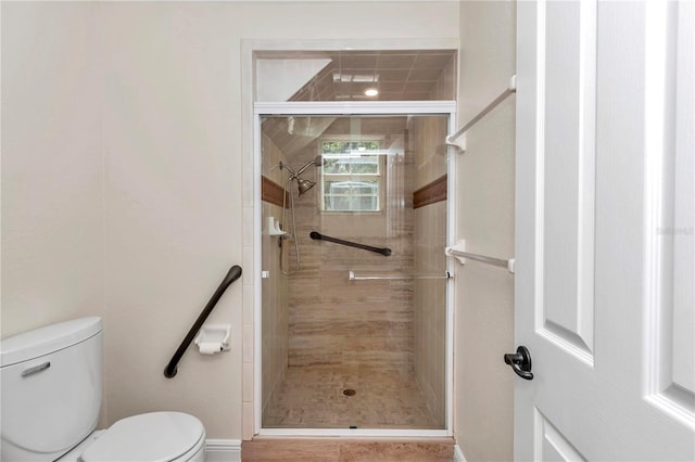 bathroom with walk in shower and toilet