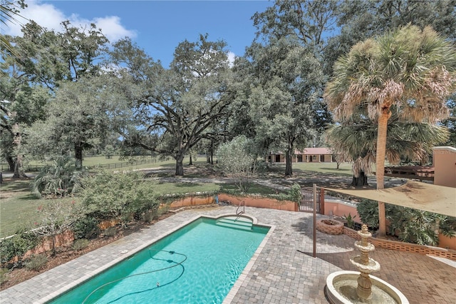 view of swimming pool featuring a patio