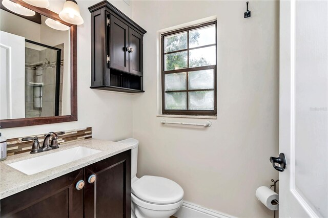 bathroom featuring toilet and vanity