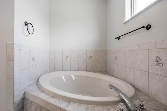 bathroom with tiled tub