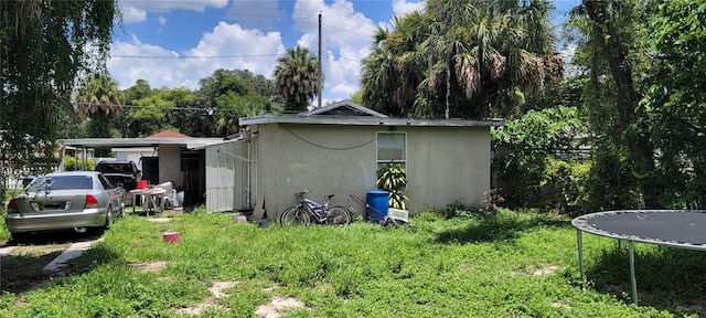 view of home's exterior with a trampoline