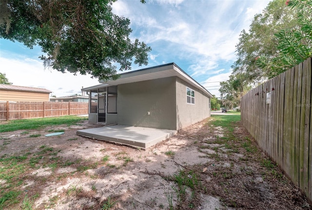 back of house with a patio