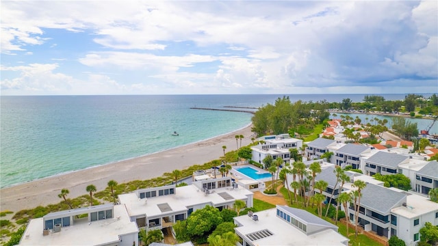 bird's eye view featuring a water view and a view of the beach