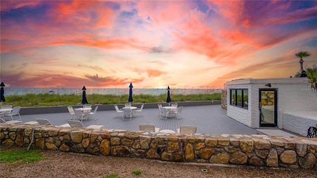 view of patio terrace at dusk