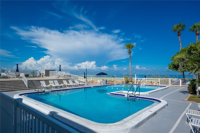 view of swimming pool with a patio