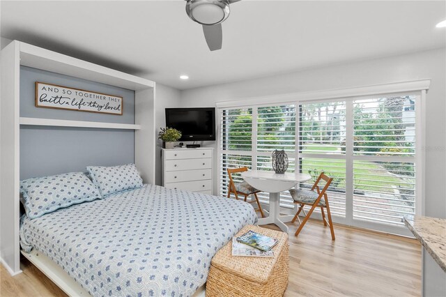 bedroom featuring light hardwood / wood-style floors and ceiling fan