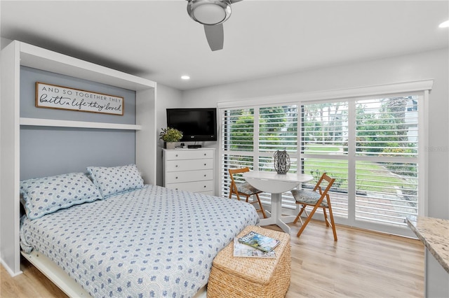 bedroom featuring light wood finished floors, a ceiling fan, and recessed lighting