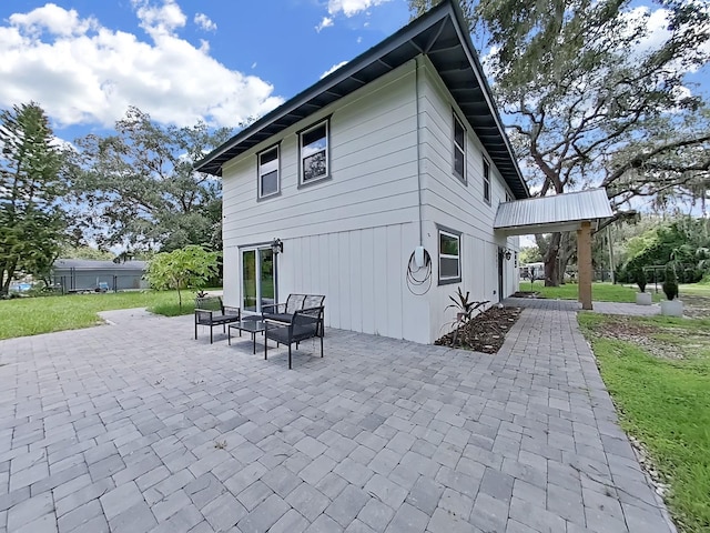 rear view of house featuring a patio