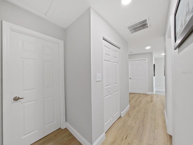 hallway featuring light wood-type flooring