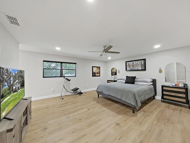 bedroom with light hardwood / wood-style floors and ceiling fan