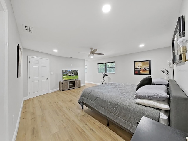 bedroom with ceiling fan and hardwood / wood-style floors