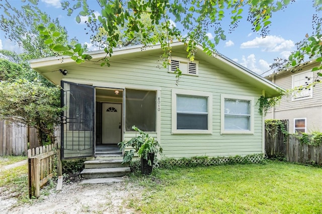 view of front of home with a front yard