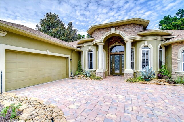 view of front of property with a garage