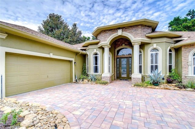 doorway to property featuring a garage